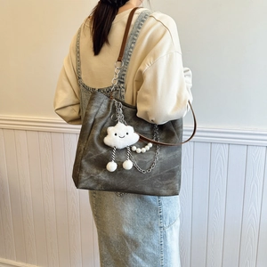 Minimalist dark grey canvas tote bag with chain strap and cute cloud charm detail