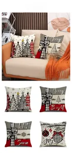 Detail of four Christmas pillow covers with tree prints and festive holiday typography