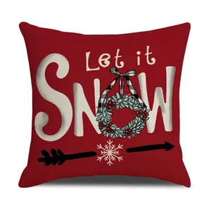 Red Christmas pillowcase featuring Let it SNOW text and a holly wreath on linen fabric