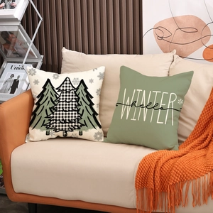 Set of two Christmas throw pillows with winter pine tree prints and Hello Winter text