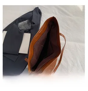 Detail view of large tote bag interior showing main compartment and zipper pockets