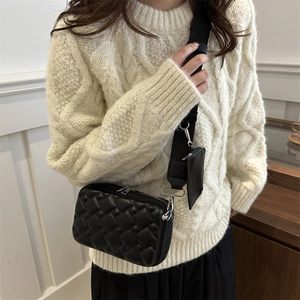 Chic black quilted crossbody bag with adjustable wide strap and small coin pouch attachment