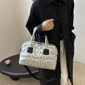 Silver quilted tote bag with metallic finish and adjustable strap for women