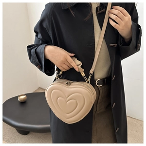 Chic heart-shaped crossbody bag with pleated handle and beige PU leather finish