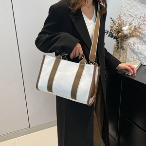 White canvas tote bag with olive stripes and brown leather trim for commuting