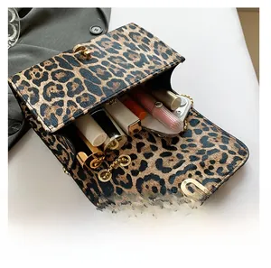 Detailed view of the leopard print crossbody bag interior showing daily storage space