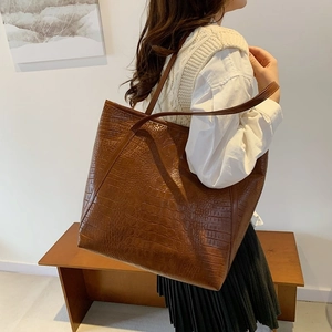 Brown crocodile embossed tote bag for women showing large capacity and stylish design