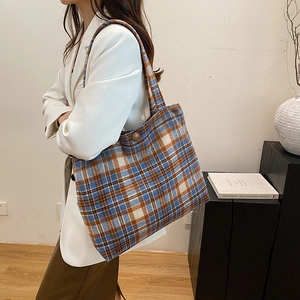 Chic blue and orange plaid tote bag with wooden button accent for autumn winter fashion