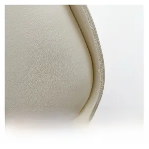 Close-up of off-white crescent bag showing premium lychee texture leather and fine stitching