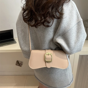 Chic beige crossbody square bag with a golden oval metal buckle and thin shoulder strap