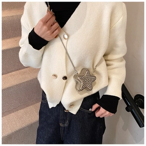 Mini star-shaped crossbody bag with rhinestones and a fine silver chain strap