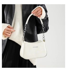 Detail of off-white crescent underarm bag with silver chain and FASHION & BAGS logo
