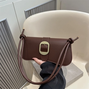 Vintage dark brown baguette bag with a textured gold buckle and knotted leather strap