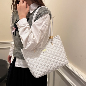 White quilted tote bag with golden fashion plaque and minimalist retro stitching