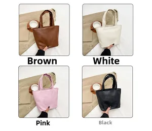 Detail view of mini soft PU leather handbags in brown, white, pink and black colors