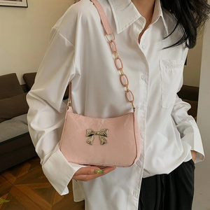Pink crescent underarm bag with silver bow and stylish acrylic chain strap for women