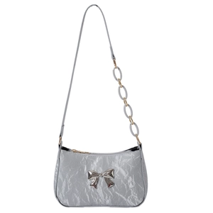 Silver metallic crescent underarm bag with pleated texture and bow detail