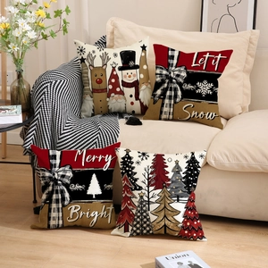 Set of four Christmas linen pillow covers with festive snowman and gnome patterns