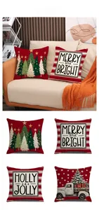 Detail of four Christmas linen pillow covers with festive red truck and tree prints