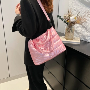 Pink quilted down tote bag with glossy finish and wide shoulder strap for women