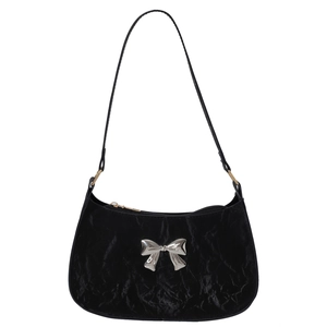 Chic black crescent underarm bag in pleated velvet with silver metallic bow detail