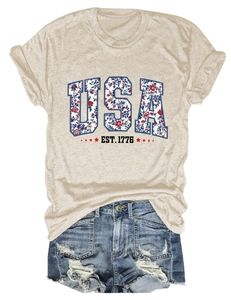 Detail of USA EST 1776 floral print on oatmeal crew neck t-shirt with denim shorts
