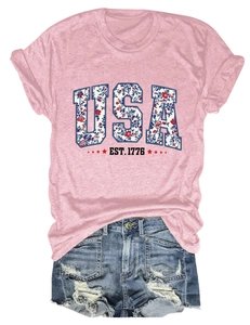 Detail of pink USA star T-shirt paired with distressed blue denim shorts for summer