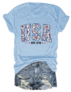 Detail of USA EST. 1776 graphic tee with floral print and distressed denim shorts set