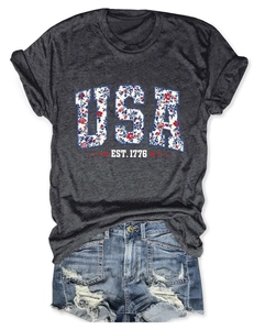 Close-up of USA EST. 1776 graphic print on heather grey textured cotton t-shirt fabric