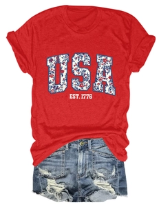 Macro detail of USA EST. 1776 floral print on red cotton blend t-shirt fabric