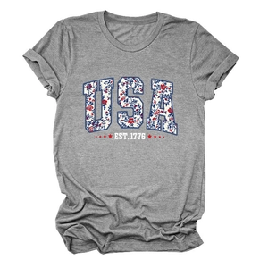 Close-up of USA EST. 1776 floral letters and star print on grey cotton t-shirt fabric