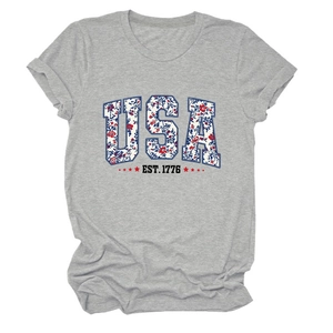 Close-up of USA EST. 1776 floral print and red star on gray cotton blend T-shirt