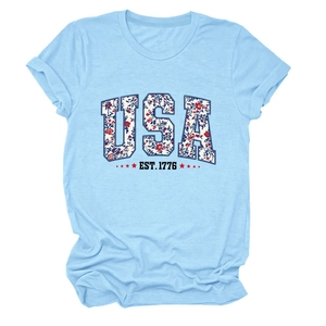 Close-up of USA EST. 1776 floral letter print on light blue cotton t-shirt