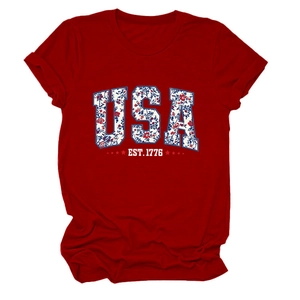 Detailed flat lay of red cotton t-shirt featuring floral USA and EST 1776 print
