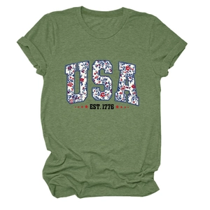 Close-up of USA EST. 1776 floral print and red stars on olive green cotton T-shirt