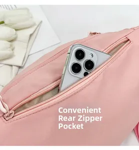 Sac bandoulière rose imperméable avec poche arrière zippée antivol pour les smartphones