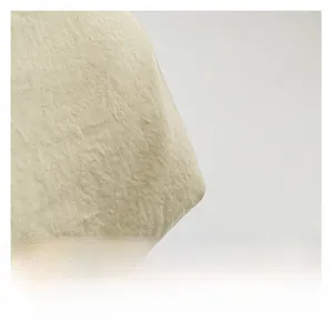 Macro shot of high-quality beige canvas textile showing thick natural linen texture detail