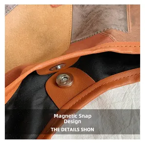 Detail view of the magnetic snap closure and texture of this retro patchwork tote bag