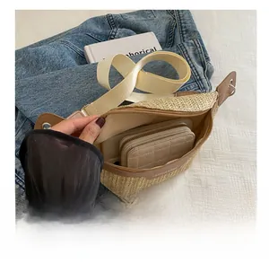 Detailed interior of woven straw fanny pack showing storage capacity for essentials
