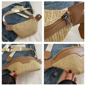 Detail of woven straw crossbody bag with brown leather trim and metal zipper hardware