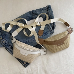 Fashionable woven straw crossbody bag with wide shoulder strap in white and brown