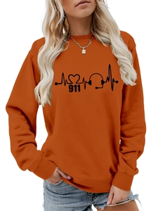 Detail of orange crewneck sweatshirt featuring a black 911 dispatcher heartbeat print