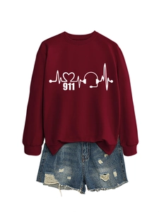 Detail of burgundy sweatshirt with heartbeat and 911 graphic paired with frayed denim shorts
