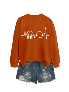 Close-up of orange crewneck sweatshirt with 911 heart rhythm and headphone graphic print