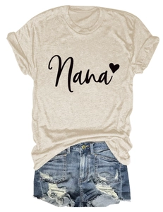 Flat lay of beige Nana heart t-shirt tucked into distressed blue denim shorts