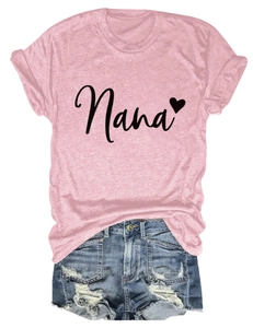 Detailed flat lay of a pink Nana heart T-shirt paired with distressed blue denim shorts