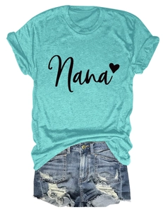 Flat lay of a mint green Nana heart print t-shirt paired with frayed denim shorts