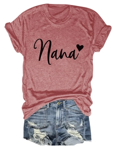 Detail of Nana heart print on red T-shirt with distressed denim shorts set