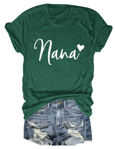 Flat lay of a dark green Nana heart T-shirt with distressed blue denim shorts outfit