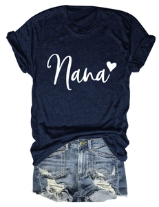 Flat lay of navy Nana heart t-shirt paired with distressed denim shorts on white background